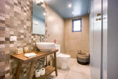 a bathroom with a sink and a toilet at Pagrati/Hilton area, Bentzi (3) Boutique Apt. for 4 in Athens