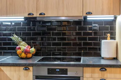 a kitchen with a bowl of fruit on a counter at Piraeus Port Exclusive in Piraeus