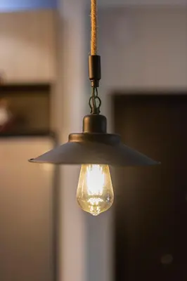 a light bulb hanging from a ceiling at Piraeus Port Exclusive in Piraeus