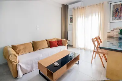 a living room with a couch and a table at The 