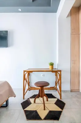 a wooden table and a stool in a room at The 