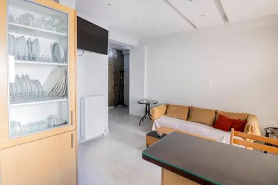 a living room with a couch and a table at The 