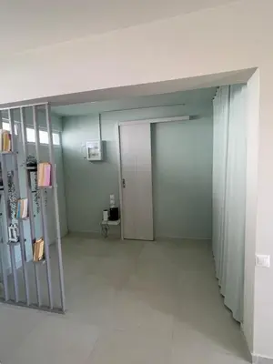 an empty room with a door in a room at Sophia's apartment in Saronida