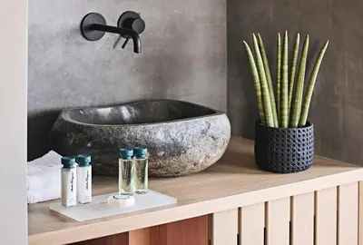 a bathroom with a sink and a bowl on a shelf at Cama Luxury Suites Glyfada in Athens
