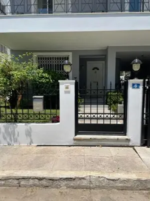 a black and white door to a house at Kalimera Alimos Apartment in Athens