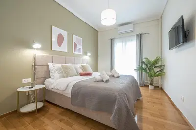a bedroom with a large bed and a television at The 