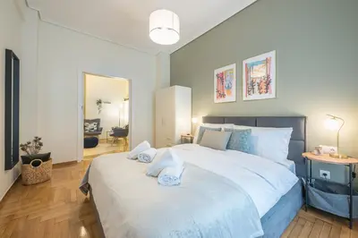 a bedroom with a large bed with towels on it at The 