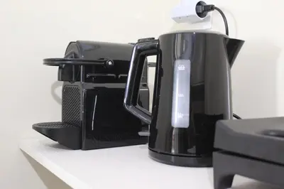 a coffee maker sitting on top of a counter at Suite 2 Bedrooms in Athens