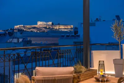 a view of the acropolis from a balcony at night at Parthenon Dream, breathtaking views with massage chair in Athens