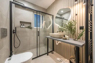 a bathroom with a shower and a toilet and a sink at Parthenon Dream, breathtaking views with massage chair in Athens