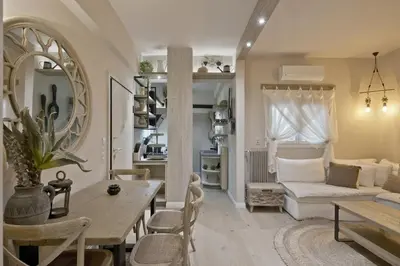 a living room with a table and a couch at Stylish Apartment at Pagrati in Athens