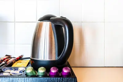 a tea kettle sitting on top of a counter at Lis153 by Smart Cozy Suites - Top Floors with Amazing City View - Available 24hr in Athens