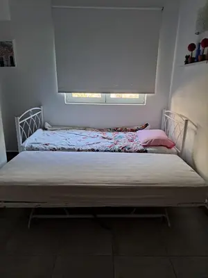 a bed in a room with a window at Landscape luxury flat Psyrri square in Athens