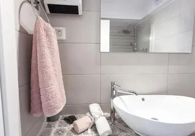 a bathroom with a sink and a bath tub at Fedias Luxury flat Psyrri square in Athens