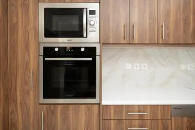 a kitchen with a microwave and a stove at Ozone Complex by A&D Properties in Porto Rafti