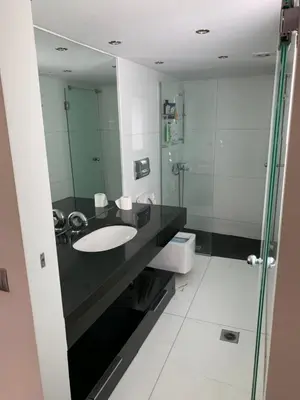 a bathroom with a sink and a mirror at Olvias Apartment in Athens