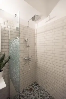 a shower with a glass door in a bathroom at Blue Ark Comfort near Acropolis in Athens