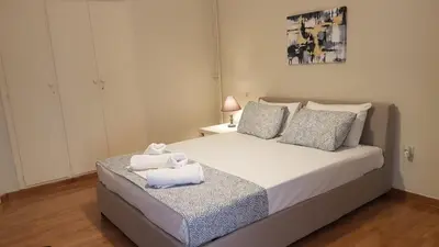 a bedroom with a bed with two towels on it at Begonia-Athens Center, 6 BD, 2,5 BATH in Athens