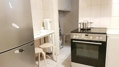 a kitchen with a stove with a pot on top of it at Begonia-Athens Center, 6 BD, 2,5 BATH in Athens