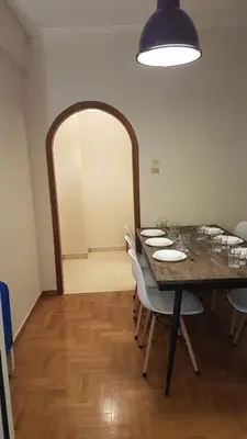 a dining room with a long table and chairs at Begonia-Athens Center, 6 BD, 2,5 BATH in Athens