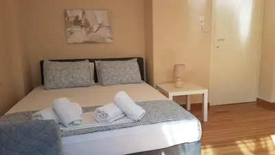 a bedroom with a bed with towels on it at Coral Athens Centrer - 3,5 BD , 2 BATH in Athens