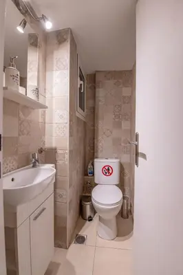 a small bathroom with a toilet and a sink at Marina Zeas Classyhub in Piraeus