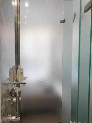 a bathroom with a metal door in a room at KYMA Apartments - Athens Acropolis 22 in Athens