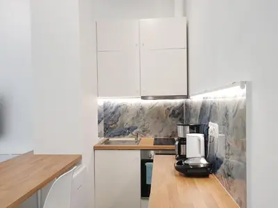 a kitchen with a coffee maker on a counter at KYMA Apartments - Athens Acropolis 22 in Athens