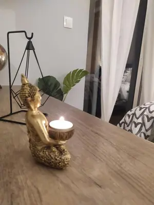 a candle sitting on top of a table at Athenian Sun-Kissed Penthouse with huge Balcony! in Athens