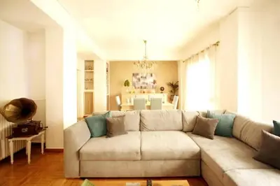 a living room with a couch and a table at Νew Thission Luxury Apartment in Athens