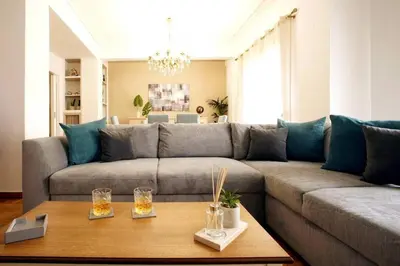 a living room with a couch and a table at Νew Thission Luxury Apartment in Athens