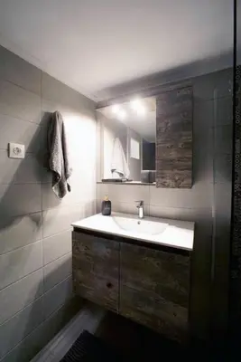 a bathroom with a sink and a mirror at Νew Thission Luxury Apartment in Athens