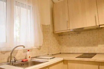 a kitchen with a sink and a window at Kallithea's breeze in Athens