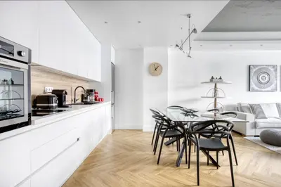 a kitchen and dining room with a table and chairs at Kallirrois 89 Suite in Athens