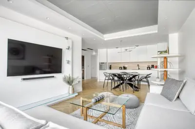a living room with a couch and a table at Kallirrois 89 Suite in Athens
