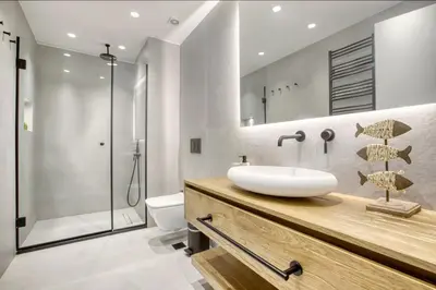 a bathroom with a sink and a shower at Kallirrois 89 Suite in Athens