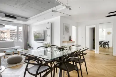 a dining room with a glass table and chairs at Kallirrois 89 Suite in Athens