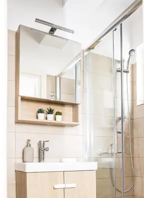 a bathroom with a sink and a shower at Boho Blu by A&D Properties in Porto Rafti