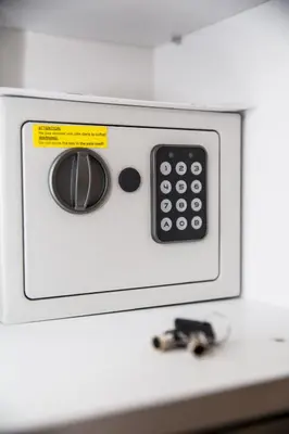 a microwave with a remote control sitting on a counter at Boho Blu by A&D Properties in Porto Rafti