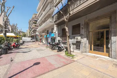 a street with motorcycles parked outside of a building at Drakou Studio in Athens