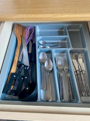 a tray filled with utensils in a drawer at Charming flat with an amazing view in Athens