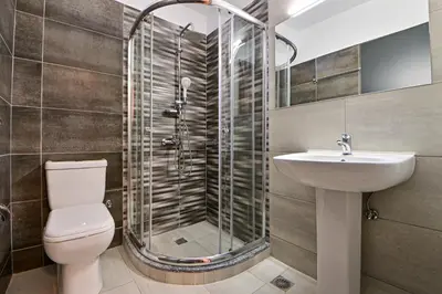a bathroom with a shower and a toilet and a sink at Waylink Residences - Piraeus Port SPT in Piraeus