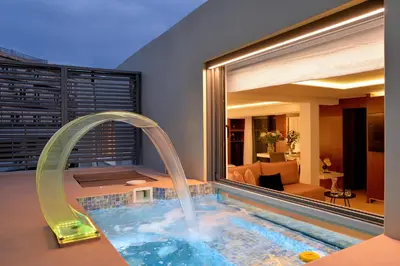 a swimming pool with a water slide in a house at Alva Athens Hotel in Athens