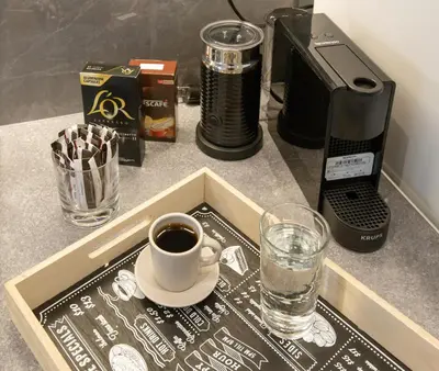 a tray with a cup of coffee on a counter at niovi cozy home in Athens