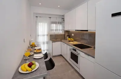 a kitchen with two plates of fruit on a counter at niovi cozy home in Athens