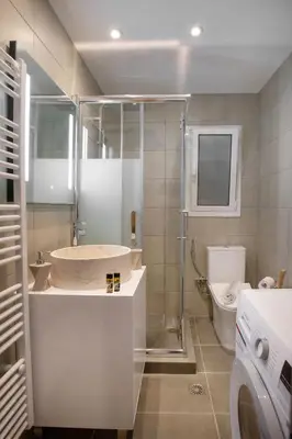 a bathroom with a sink and a toilet at niovi cozy home in Athens