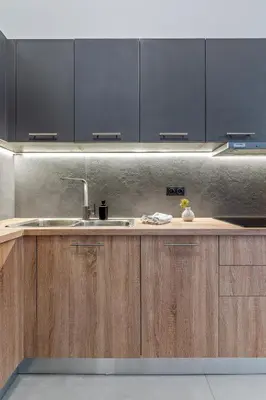 a kitchen with wooden cabinets and a sink at Athena Studio in Gazi in Athens