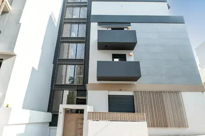 an external view of a building with balconies at Athena Studio in Gazi in Athens