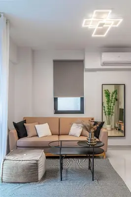 a living room with a couch and a table at Athena Studio in Gazi in Athens