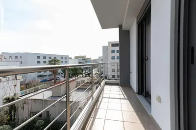 a balcony with a view of a city at Stylish spacious apartment in Palaio Faliro (C1) in Athens
